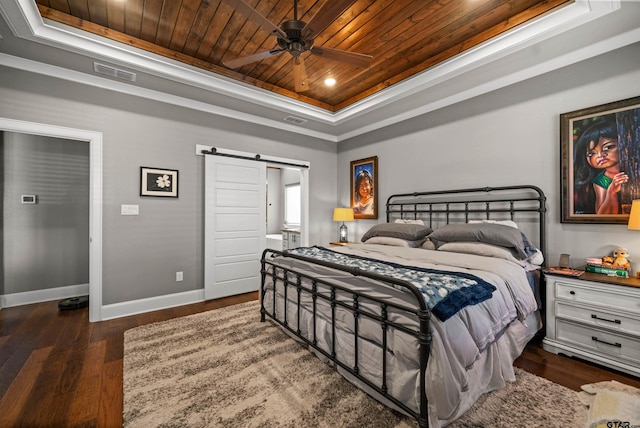 21562 Castle Rock Cir, Bullard, TX 75757 - bedroom with a raised ceiling, wooden ceiling, a barn door, baseboards, and wood finished floors