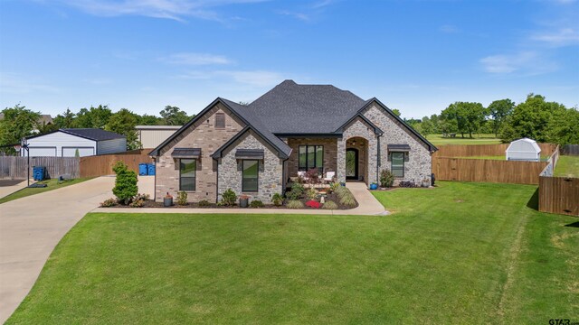 21562 Castle Rock Cir, Bullard, TX 75757 - french country inspired facade featuring roof with shingles, brick siding, driveway, and stone siding