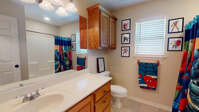 bathroom with toilet, tile patterned floors, a notable chandelier, vanity, and a shower with shower curtain