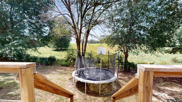 view of yard with a trampoline