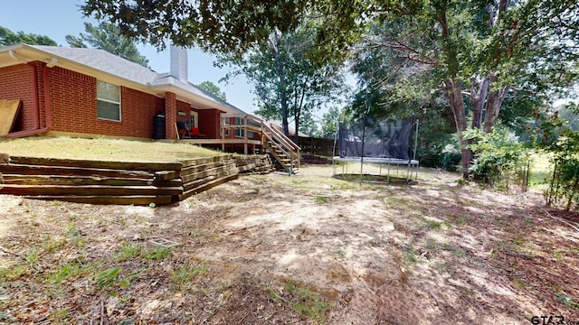 view of yard with a trampoline