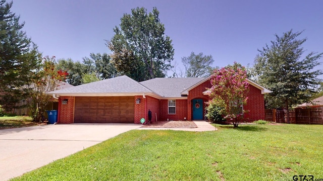 single story home with a garage and a front yard