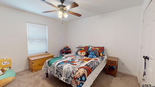 bedroom featuring light carpet and ceiling fan