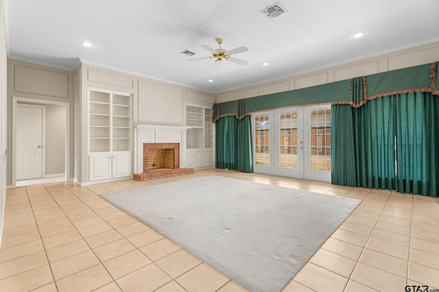 unfurnished living room featuring ornamental molding, tile patterned flooring, visible vents, and built in features