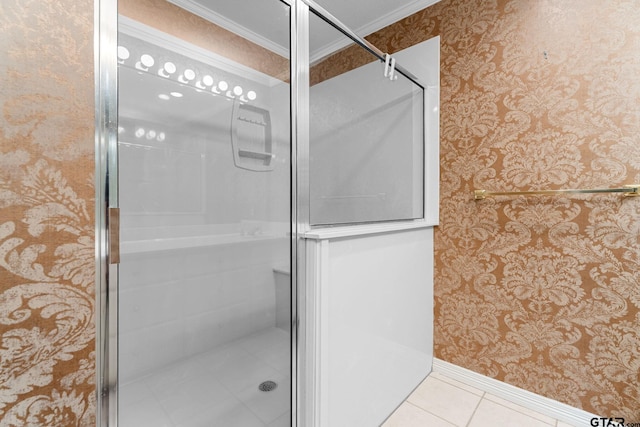 full bath featuring wallpapered walls, baseboards, ornamental molding, tile patterned flooring, and a shower stall