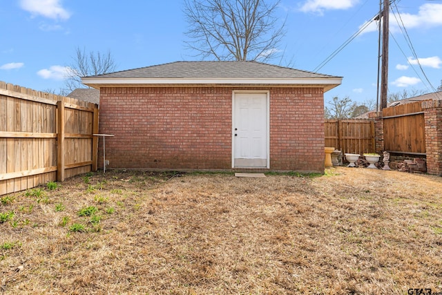 view of outdoor structure with a fenced backyard