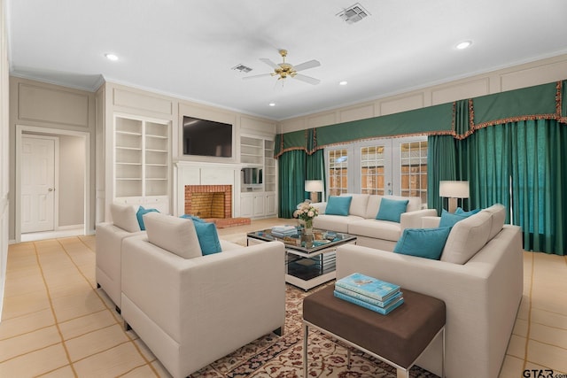 living area featuring a fireplace, visible vents, built in features, and ornamental molding