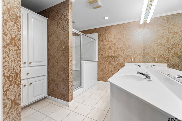 full bath featuring tile patterned floors, a sink, a shower stall, and wallpapered walls