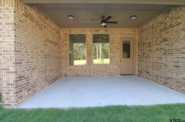 view of patio featuring ceiling fan