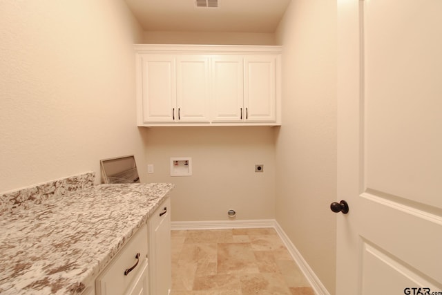 laundry room with cabinets, hookup for a washing machine, and electric dryer hookup