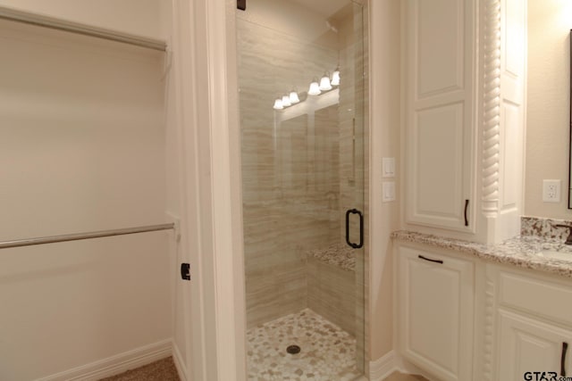 bathroom with vanity and an enclosed shower