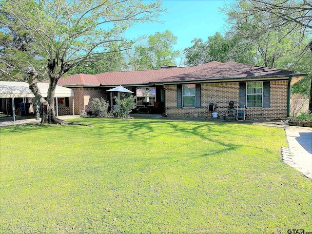 single story home featuring a front lawn and brick siding