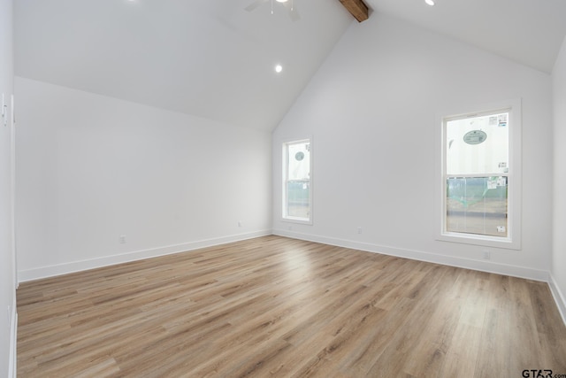 additional living space with high vaulted ceiling, beamed ceiling, ceiling fan, and light hardwood / wood-style flooring