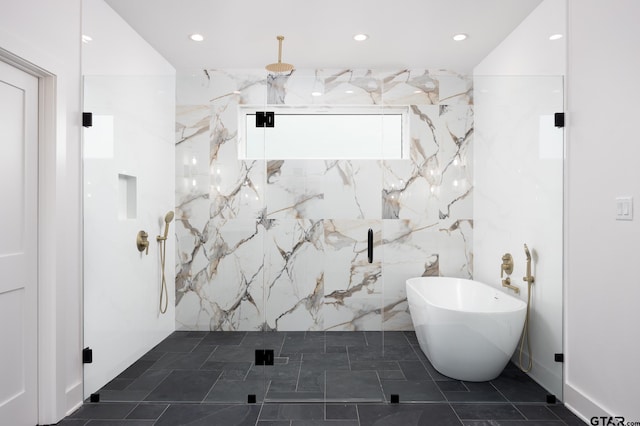 bathroom featuring tile walls and shower with separate bathtub