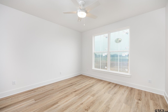 unfurnished room featuring light wood-type flooring and ceiling fan