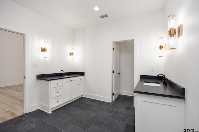 bathroom featuring wood-type flooring and vanity