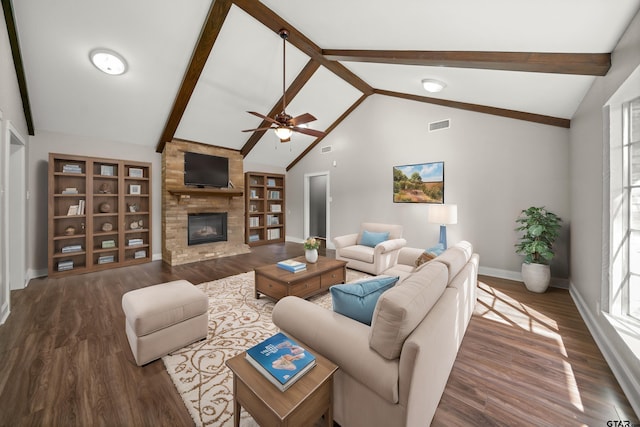 living area with lofted ceiling with beams, dark wood-style floors, and a fireplace