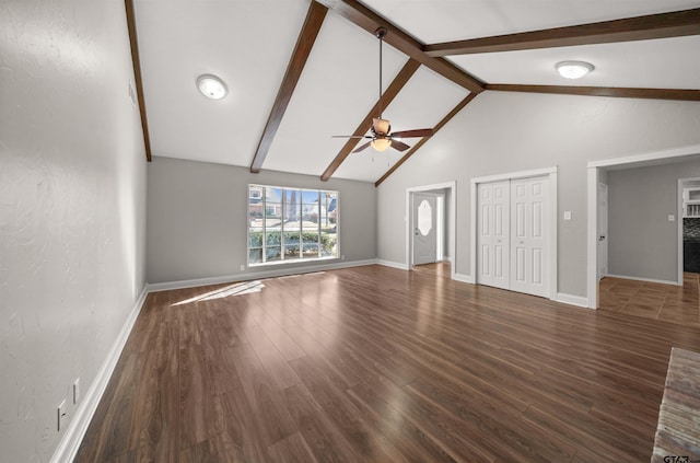 unfurnished living room featuring a ceiling fan, wood finished floors, high vaulted ceiling, beamed ceiling, and baseboards