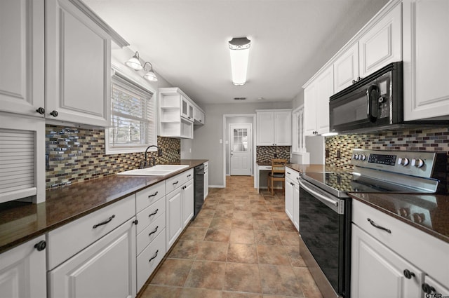 kitchen featuring black appliances, tasteful backsplash, a sink, and white cabinets