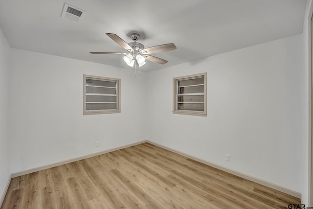 unfurnished room with ceiling fan and light hardwood / wood-style flooring