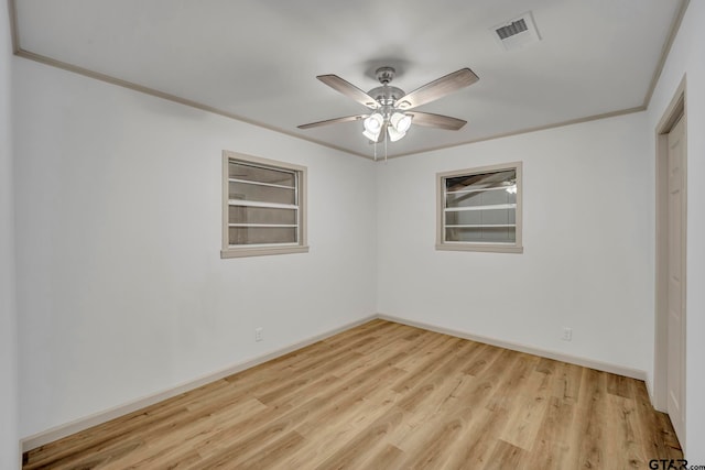 unfurnished room featuring ornamental molding, light hardwood / wood-style floors, and ceiling fan