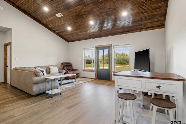 living area featuring high vaulted ceiling, wooden ceiling, and light wood-style floors