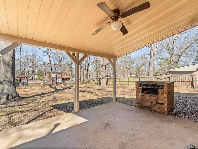 view of patio with a fenced backyard and a ceiling fan