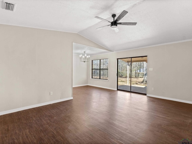 unfurnished room featuring visible vents, ceiling fan with notable chandelier, a textured ceiling, dark wood-style floors, and lofted ceiling