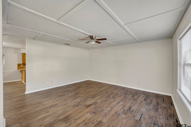 unfurnished room featuring dark hardwood / wood-style floors and ceiling fan