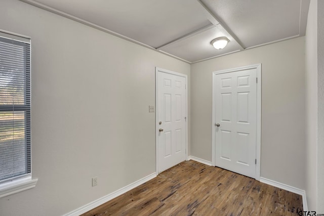 spare room featuring hardwood / wood-style flooring