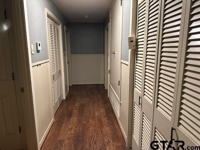 504 Mt Sylvan, Lindale, TX 75771 - corridor featuring dark wood-type flooring and a wainscoted wall