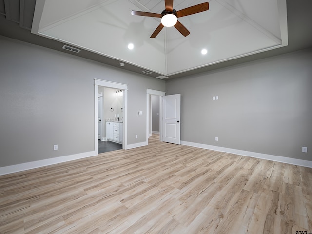 328 Heritage Way, Bullard, TX 75757 - unfurnished bedroom featuring wood finished floors, ensuite bathroom, baseboards, a ceiling fan, and high vaulted ceiling