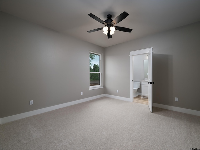 328 Heritage Way, Bullard, TX 75757 - unfurnished bedroom with light colored carpet, baseboards, ensuite bathroom, and ceiling fan