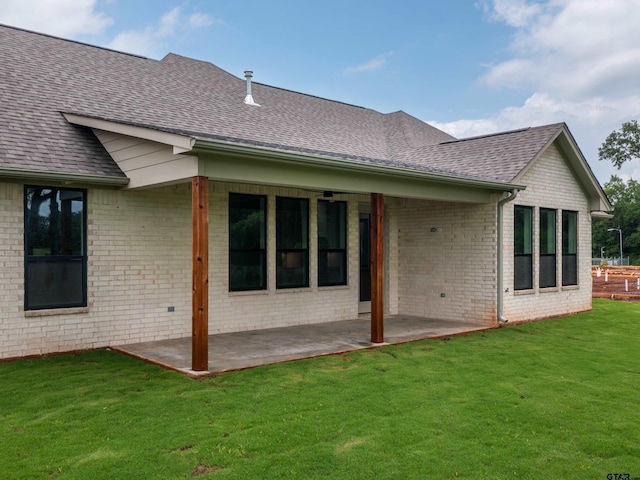 328 Heritage Way, Bullard, TX 75757 - back of property with a shingled roof, a patio area, brick siding, and a lawn