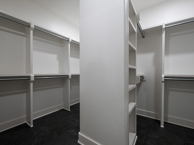 328 Heritage Way, Bullard, TX 75757 - walk in closet featuring dark tile patterned flooring