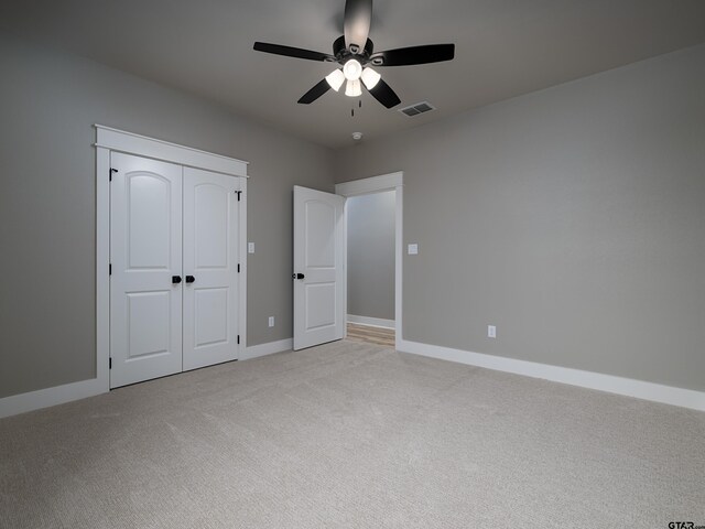 328 Heritage Way, Bullard, TX 75757 - unfurnished bedroom with light carpet, baseboards, ceiling fan, and a closet
