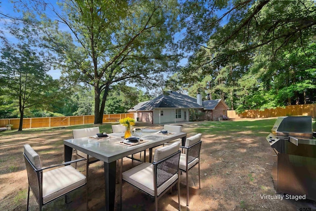 17570 Regal Row, Flint, TX 75762 - view of patio / terrace with outdoor dining space and a grill