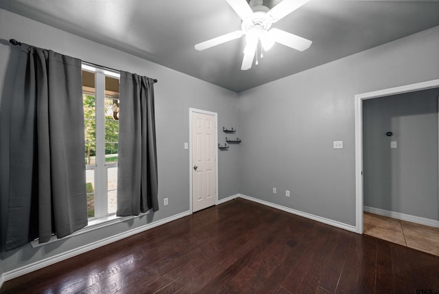 17570 Regal Row, Flint, TX 75762 - unfurnished room with ceiling fan, wood finished floors, and baseboards