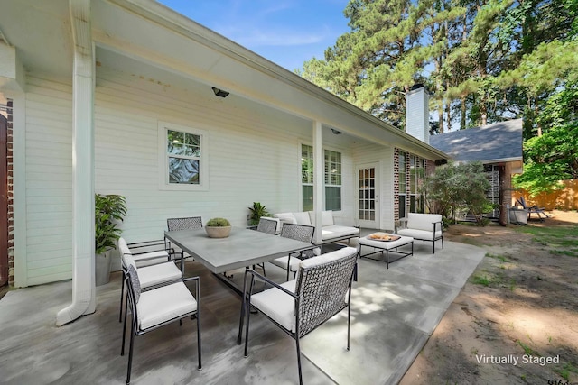 17570 Regal Row, Flint, TX 75762 - view of patio / terrace with an outdoor living space with a fire pit and outdoor dining area