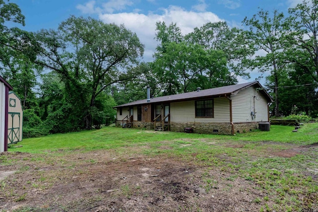 16850 Rainbow Ridge Cir, Tyler, TX 75707 - view of front of property with cooling unit, a front yard, and stone siding