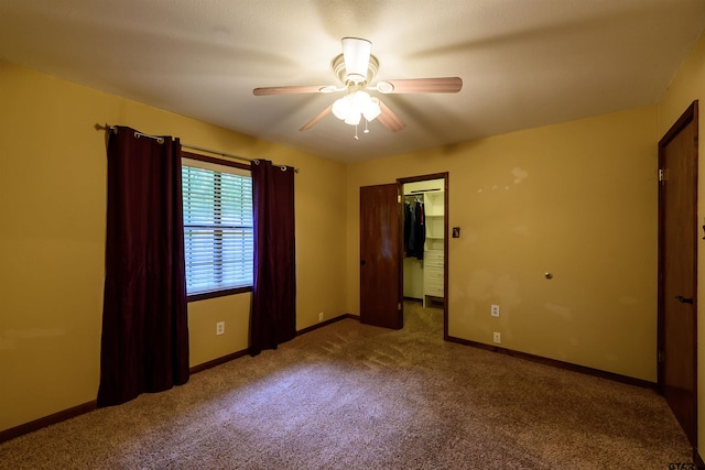 16850 Rainbow Ridge Cir, Tyler, TX 75707 - unfurnished bedroom featuring carpet flooring, baseboards, a spacious closet, ceiling fan, and a closet