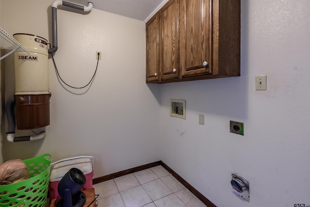 16850 Rainbow Ridge Cir, Tyler, TX 75707 - laundry area featuring hookup for a washing machine, cabinet space, electric dryer hookup, baseboards, and light tile patterned floors