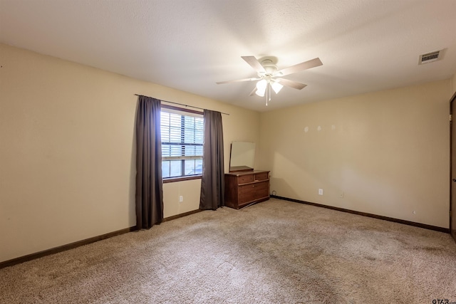 16850 Rainbow Ridge Cir, Tyler, TX 75707 - spare room featuring light carpet, ceiling fan, and baseboards