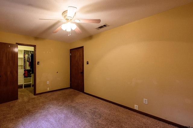 16850 Rainbow Ridge Cir, Tyler, TX 75707 - spare room featuring a ceiling fan, carpet, and baseboards