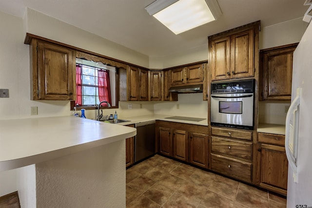 16850 Rainbow Ridge Cir, Tyler, TX 75707 - kitchen with stainless steel appliances, a sink, a peninsula, light countertops, and under cabinet range hood