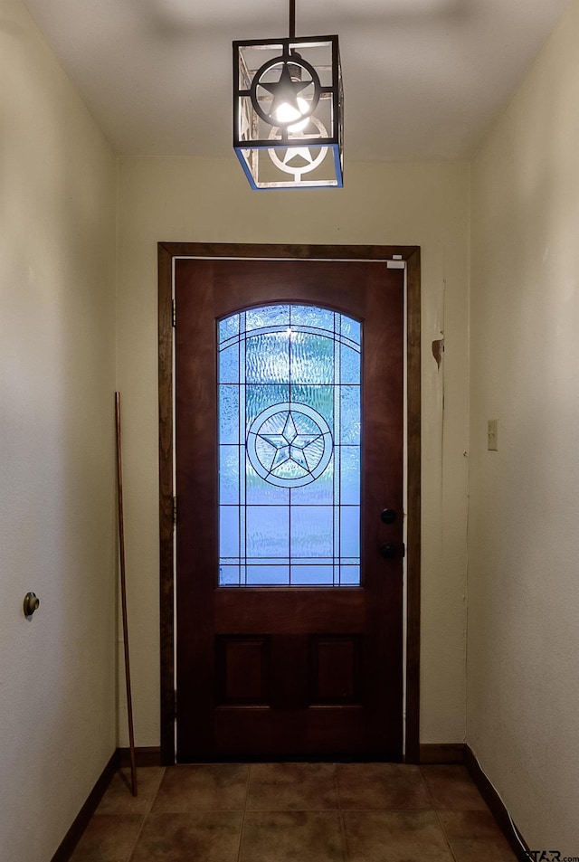16850 Rainbow Ridge Cir, Tyler, TX 75707 - foyer with baseboards, tile patterned flooring, and a chandelier