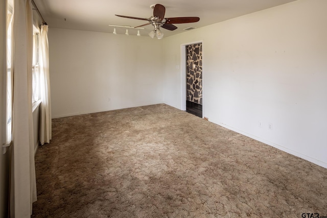 carpeted empty room featuring ceiling fan