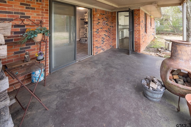 view of patio / terrace featuring fence