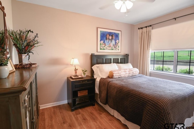 327 Dailey Rd, Crockett, TX 75835 - bedroom featuring wood finished floors, baseboards, and ceiling fan