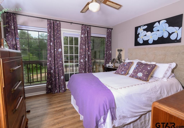 327 Dailey Rd, Crockett, TX 75835 - bedroom featuring wood finished floors, ceiling fan, and baseboards